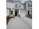 Two story townhome with attached garage and stone accents at 2499 Skyline Loop, Kissimmee, FL 34758