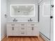 Modern bathroom with double vanity and sleek fixtures at 25335 Troon Ave, Sorrento, FL 32776