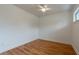 Empty bedroom with light walls and wood floors at 25335 Troon Ave, Sorrento, FL 32776