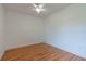 Empty bedroom with light walls and wood floors at 25335 Troon Ave, Sorrento, FL 32776