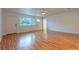 Living room with hardwood floors, a window, and an exterior door at 25335 Troon Ave, Sorrento, FL 32776