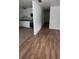 Bright hallway with wood-look laminate flooring at 2863 County Road 238 # 238, Wildwood, FL 34785