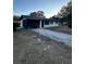 Front view of a single-story house with a screened porch at 2863 County Road 238 # 238, Wildwood, FL 34785