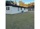 Side view of a single-story house with a grassy yard at 2863 County Road 238 # 238, Wildwood, FL 34785