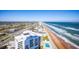 Aerial view of building, beach, and coastline at 3000 N Atlantic Ave # 17, Daytona Beach, FL 32118