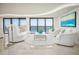 Elegant living room with ocean views, plush furniture, and a modern aesthetic at 3000 N Atlantic Ave # 17, Daytona Beach, FL 32118