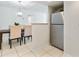 Kitchen dining area with table and chairs, adjacent to stainless steel refrigerator at 310 Cherokee Ct # B, Altamonte Springs, FL 32701