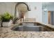 Stainless steel double sink with granite countertop in the kitchen at 310 Cherokee Ct # B, Altamonte Springs, FL 32701