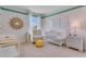 Charming Bedroom with crib, armchair, and plenty of natural light at 3826 Royal Azalea Way, Sanford, FL 32773