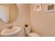 Simple and clean half bathroom with a pedestal sink and toilet at 3834 Royal Azalea Way, Sanford, FL 32773