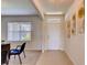 Bright and airy entryway with tile flooring and a view into a home office at 3834 Royal Azalea Way, Sanford, FL 32773