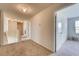 Upstairs hallway with carpeted floor and access to bedrooms at 3834 Royal Azalea Way, Sanford, FL 32773