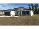 New construction home with gray garage door and stone accents at 3901 Sw 161St Loop, Ocala, FL 34473