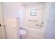 Bathroom with shower, tub and tile flooring at 3934 Ne 21St Ln, Ocala, FL 34470