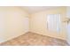 Simple bedroom with tile floor, window, and closet at 3934 Ne 21St Ln, Ocala, FL 34470