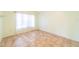 Spacious bedroom with large window and tile floors at 3934 Ne 21St Ln, Ocala, FL 34470