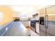 Stainless steel appliances and light-colored cabinets in kitchen at 3934 Ne 21St Ln, Ocala, FL 34470