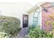 Side entry with landscaping and brick accents at 3934 Ne 21St Ln, Ocala, FL 34470