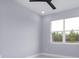 Spacious bedroom with light grey walls and a large window at 39715 Royal Trails Road, Eustis, FL 32736