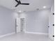 Spacious bedroom with two doors and ceiling fan at 39715 Royal Trails Road, Eustis, FL 32736