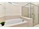 Bathroom with garden tub and walk-in shower at 4021 Lana Ave, Davenport, FL 33897