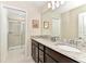 Bathroom with double vanity and shower/tub combo at 4021 Lana Ave, Davenport, FL 33897