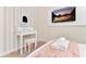 Bedroom featuring vanity, walls with stripes, and a TV at 4021 Lana Ave, Davenport, FL 33897