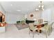 Bright dining area with modern light fixture and seating for six at 4021 Lana Ave, Davenport, FL 33897