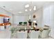 Open dining area with glass table and modern chandelier at 4021 Lana Ave, Davenport, FL 33897