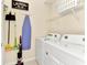 Laundry room with washer, dryer, and ample storage at 4021 Lana Ave, Davenport, FL 33897