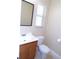 Bright bathroom features a modern sink and toilet with natural light from a window at 4131 Yorketowne Rd, Orlando, FL 32812