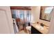 Bright bathroom with a tiled shower-tub and a well-lit vanity area at 4131 Yorketowne Rd, Orlando, FL 32812