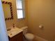 Updated bathroom includes a vanity, toilet and decorative mirror at 4131 Yorketowne Rd, Orlando, FL 32812