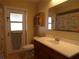 Bathroom with shower, vanity and exterior access at 4131 Yorketowne Rd, Orlando, FL 32812