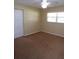 Bedroom with carpet flooring, a ceiling fan, and a double door closet at 4131 Yorketowne Rd, Orlando, FL 32812