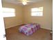 Small bedroom with twin bed and ceiling fan at 4131 Yorketowne Rd, Orlando, FL 32812