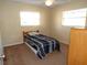 Small bedroom with twin bed and ceiling fan at 4131 Yorketowne Rd, Orlando, FL 32812