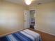 Bedroom with bed, view into another room at 4131 Yorketowne Rd, Orlando, FL 32812