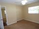 Bedroom with carpet flooring and a window at 4131 Yorketowne Rd, Orlando, FL 32812