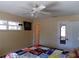 Bedroom with ceiling fan and access to bathroom at 4131 Yorketowne Rd, Orlando, FL 32812