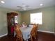 Dining room with wood table and chairs, hardwood floors and china cabinet at 4131 Yorketowne Rd, Orlando, FL 32812