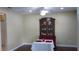 Dining room with dark wood floors, a table with patriotic decor, and a decorative cabinet at 4131 Yorketowne Rd, Orlando, FL 32812