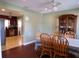 Dining room with view into kitchen and hardwood floors at 4131 Yorketowne Rd, Orlando, FL 32812