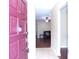 Stylish front door and foyer leading to an open living area with hardwood floors at 4131 Yorketowne Rd, Orlando, FL 32812