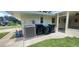 The exterior shows the utility area, screened in lanai, and the air conditioner unit at 4131 Yorketowne Rd, Orlando, FL 32812