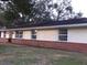 Ranch style home with brick facade and large windows at 4131 Yorketowne Rd, Orlando, FL 32812