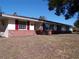 Ranch house with red shutters, and walkway at 4131 Yorketowne Rd, Orlando, FL 32812