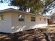 Ranch house with large windows and red shutters at 4131 Yorketowne Rd, Orlando, FL 32812