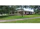A single-story home with a brick facade and a well-maintained lawn are the exterior highlights at 4131 Yorketowne Rd, Orlando, FL 32812