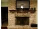 Brick fireplace with a dark metal screen at 4131 Yorketowne Rd, Orlando, FL 32812